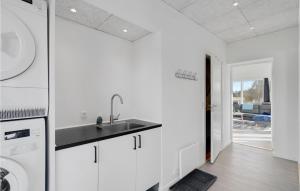 a kitchen with a sink and a dishwasher at 3 Bedroom Amazing Home In Rødby in Rødby +16 photos