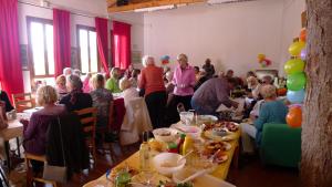 a group of people sitting at tables in a room at Camping Tropical Almunecar in Almuñécar