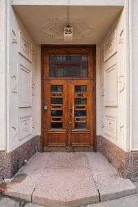 a wooden door on the side of a building at Prime City Escape 45 Square Meters in Helsinki