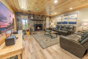 a living room with a couch and a fireplace at Dolly's Lodge # 3 condo in Sevierville