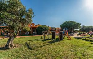 a park with a playground in the grass at Vignola Baia Dei Mirti B4 in Vignola Mare