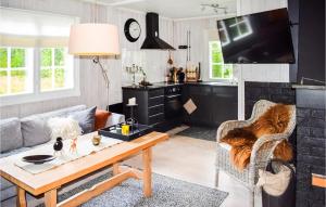 a living room with a couch and a table at 3 Bedroom Nice Home In Gol in Gol