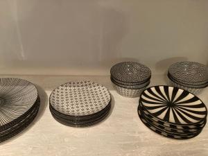 a group of plates sitting on top of a table at Zentrale reizende Wohnung für 3 Personen in Leutkirch im Allgäu +1 photo