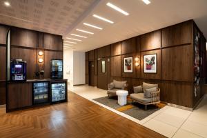 TV a/nebo společenská místnost v ubytování Novotel Vilnius Centre