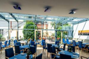 Reštaurácia alebo iné gastronomické zariadenie v ubytovaní Klinglhuber Suites