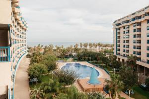 an aerial view of a resort with a pool and buildings at RESORT BEACH VALENCIA in Valencia