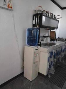 a kitchen with a sink and a counter top at Su Staycation Minimalist in Naic