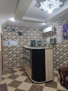 a kitchen with a counter in a room at Mirana Mayotte Hostel 47 in Ghardaïa +101 photos