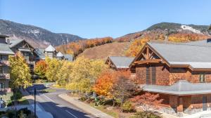an aerial view of a residential neighborhood with a mountain at Lux Mountainside 2 Bed Mountainside Condo By Stowe Mountain Rentals in Stowe
