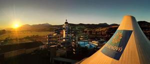 a view of a resort with a pool and a building at apartmán Sienna in Bešeňová