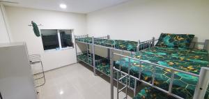 Postel nebo postele na pokoji v ubytování Homely Hostel