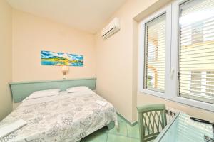 Postel nebo postele na pokoji v ubytování Albergo Atlantic