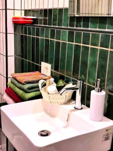 a bathroom with a sink with a basket on it at la Brunita in Rubiera +44 photos