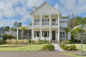 a white house with a porch at Lagoon View 3 Bedroom Moreland Village Home 5602 in Bluffton