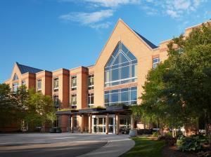 a large brick building with a large window at Haworth Hotel at Hope College in Holland