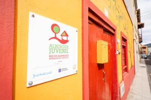 a sign on the side of a building at Hostel Tenerife in La Orotava