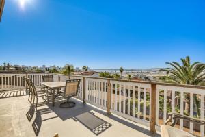 a balcony with a table and chairs and a view of the beach at 3 Mi to Balboa Park Water-View Condo with Balcony in San Diego