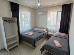 Ein Bett oder Betten in einem Zimmer der Unterkunft Cetin Pansiyon