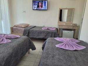 Ein Bett oder Betten in einem Zimmer der Unterkunft Cetin Pansiyon
