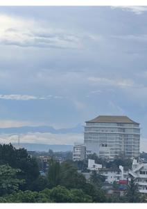 a city with a large building in the background at The Luxor Roof16 in Battaramulla
