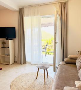 TV a/nebo společenská místnost v ubytování Villa Evita Apartments