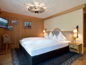Posteľ alebo postele v izbe v ubytovaní Alpenhotel Kramerwirt