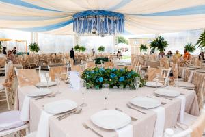 a table set up for a wedding in a marquee at Villas del Sol Hotel & Bungalows in Oaxaca City