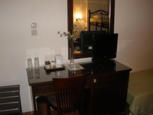 TV a/nebo společenská místnost v ubytování Pelias Hotel
