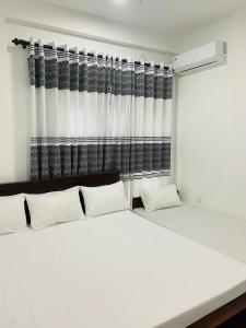 Postel nebo postele na pokoji v ubytování Induwara Holiday home