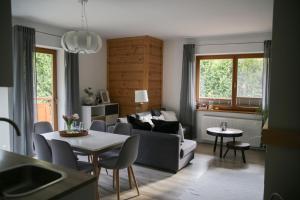 a living room with a couch and a table at Apartament Erica in Zakopane