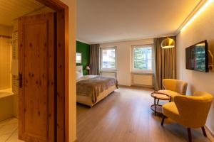 Postel nebo postele na pokoji v ubytování Hotel Europa Suites St Moritz