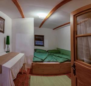 a bedroom with a bed in a room with a window at Chata Petrov nad Desnou in Petrov nad Desnou +9 photos