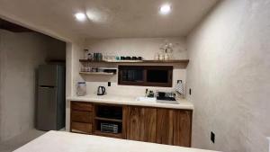 Η κουζίνα ή μικρή κουζίνα στο Hábitat Nandá +5 φωτογραφίες