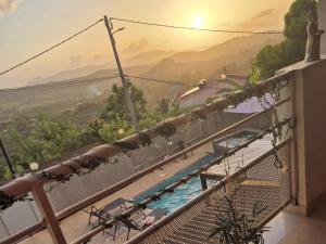 a view from the balcony of a resort with a swimming pool at Paradis Spiritain in Saint Esprit