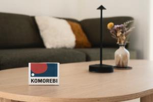 a coffee table with a sign on top of it at Chalet Komorebi with spa - Meli 1 in Sainte Béatrix