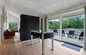 a living room with a ping pong table in it at Gorgeous Home In Oksbøl With Sauna in Oksbøl