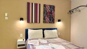 Postel nebo postele na pokoji v ubytování VA Apart Hotel Savassi