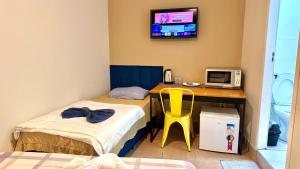Postel nebo postele na pokoji v ubytování VA Apart Hotel Savassi