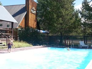a couple of people in a swimming pool at Homesteader in Clark