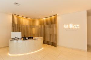 a lobby with a reception desk in a building at Le Parc Residence Deluxe Suite in Quito +48 photos