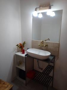 a bathroom with a sink and a mirror at Casa en Villa Ventana in Villa Ventana +11 photos