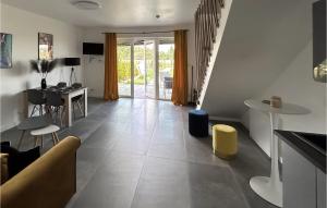 a living room with a couch and a table at Nice Home In Stare Sady With Kitchen in Stare Sady