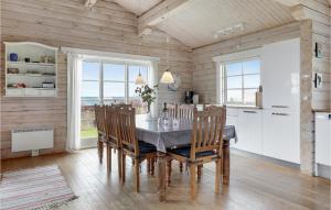 a kitchen with a dining room table and chairs at 3 Bedroom Gorgeous Home In Hasle in Hasle