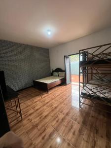 Ένα ή περισσότερα κρεβάτια σε δωμάτιο στο Quarto Duplo Praia dos Sonhos