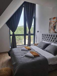Llit o llits en una habitació de Apartman Yellow Moon