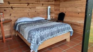 Postel nebo postele na pokoji v ubytování Cabañas Tepani