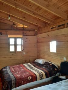 Postel nebo postele na pokoji v ubytování Cabañas Tepani + 11 fotografií