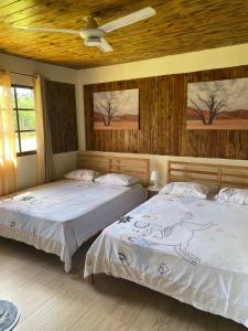 Postel nebo postele na pokoji v ubytování Villa las Rosas JP