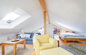 a living room with a couch and a bed at Seebrise in Süssau