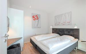 Ein Bett oder Betten in einem Zimmer der Unterkunft Passatvilla - Apartment 5